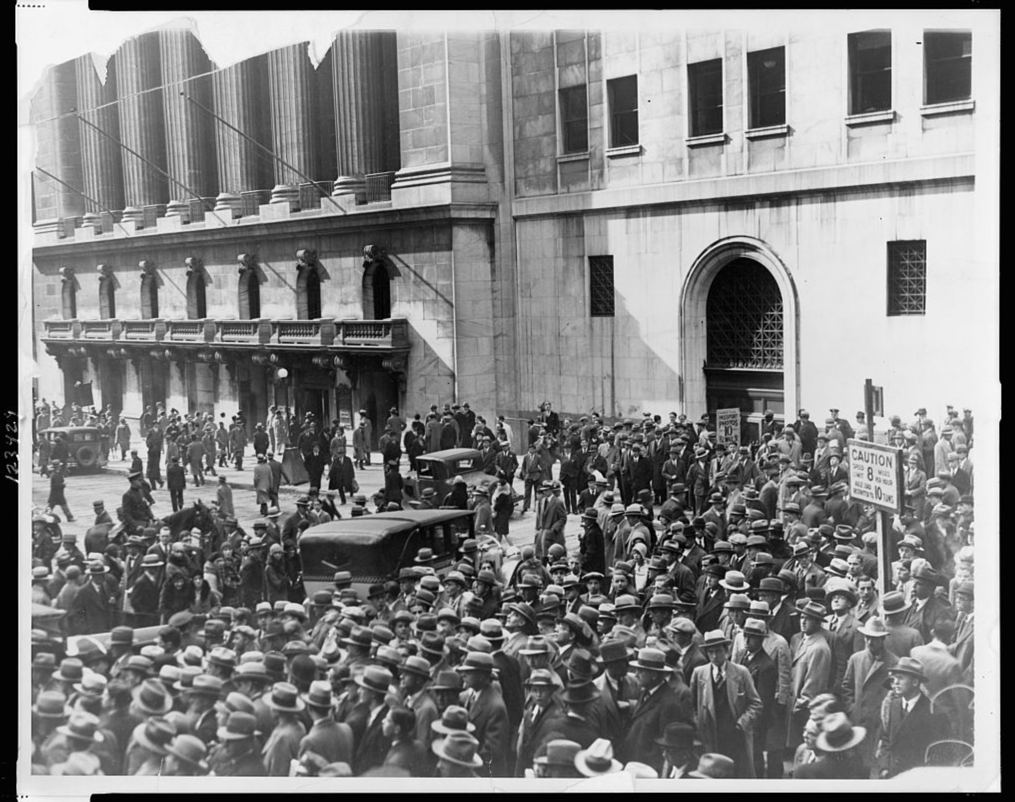 Crowd of people gather outside the New York Stock Exchange following the Crash of 1929